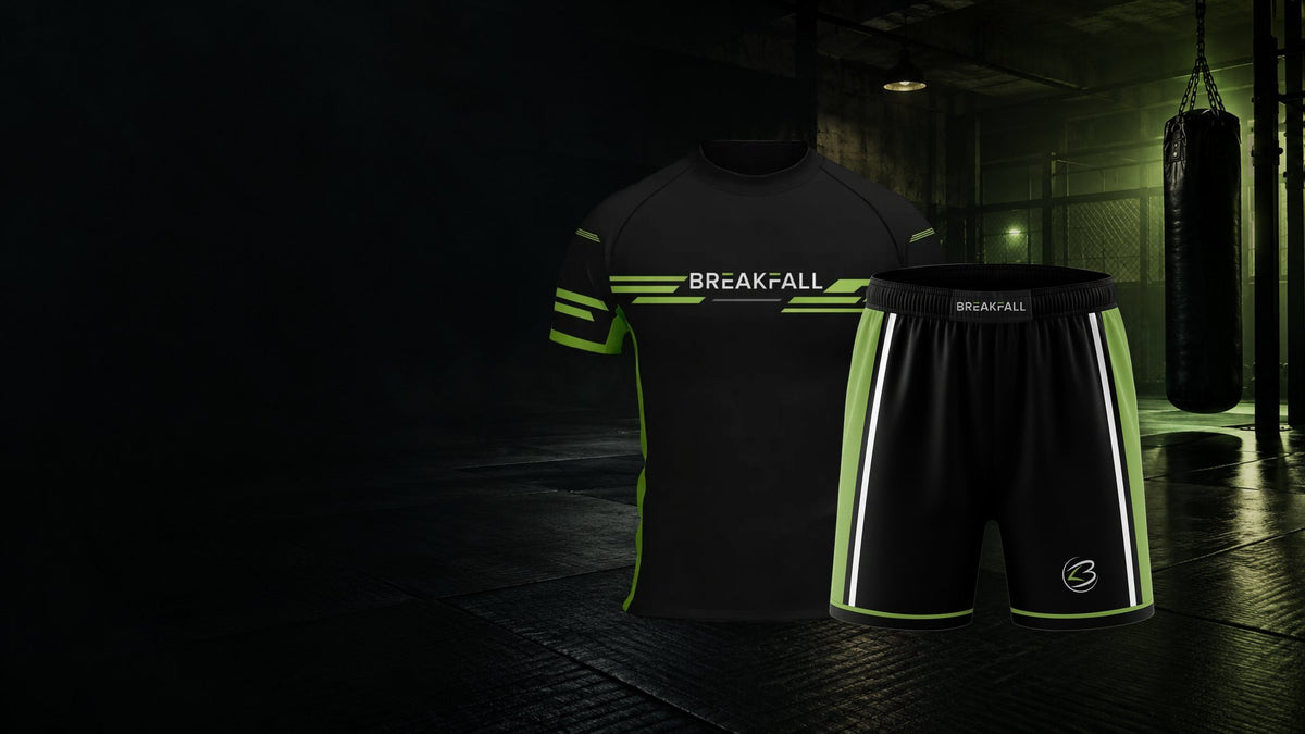 Breakfall Breakout rash guard and fight shorts in a dark martial arts gym